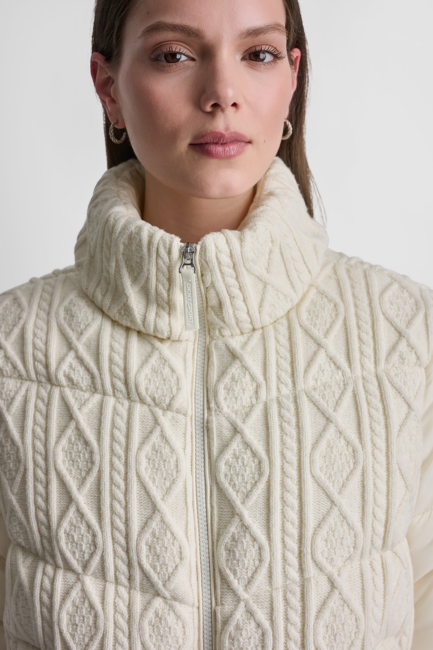 CABLE KNIT MOCK NECK PUFFER JACKET